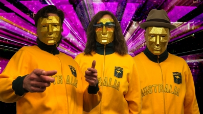 Team Australia all geared up for the AI Song Contest in their 3D-printed masks and Australian Swim Team tracksuit dating back to the 1972 Munich Olympic Games. Photo: Uncanny Valley