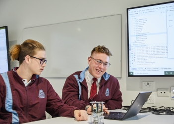 High School students Kobi Hind (left) and Connor Burke (right) experience a creative coding workshop as part of National Science Week