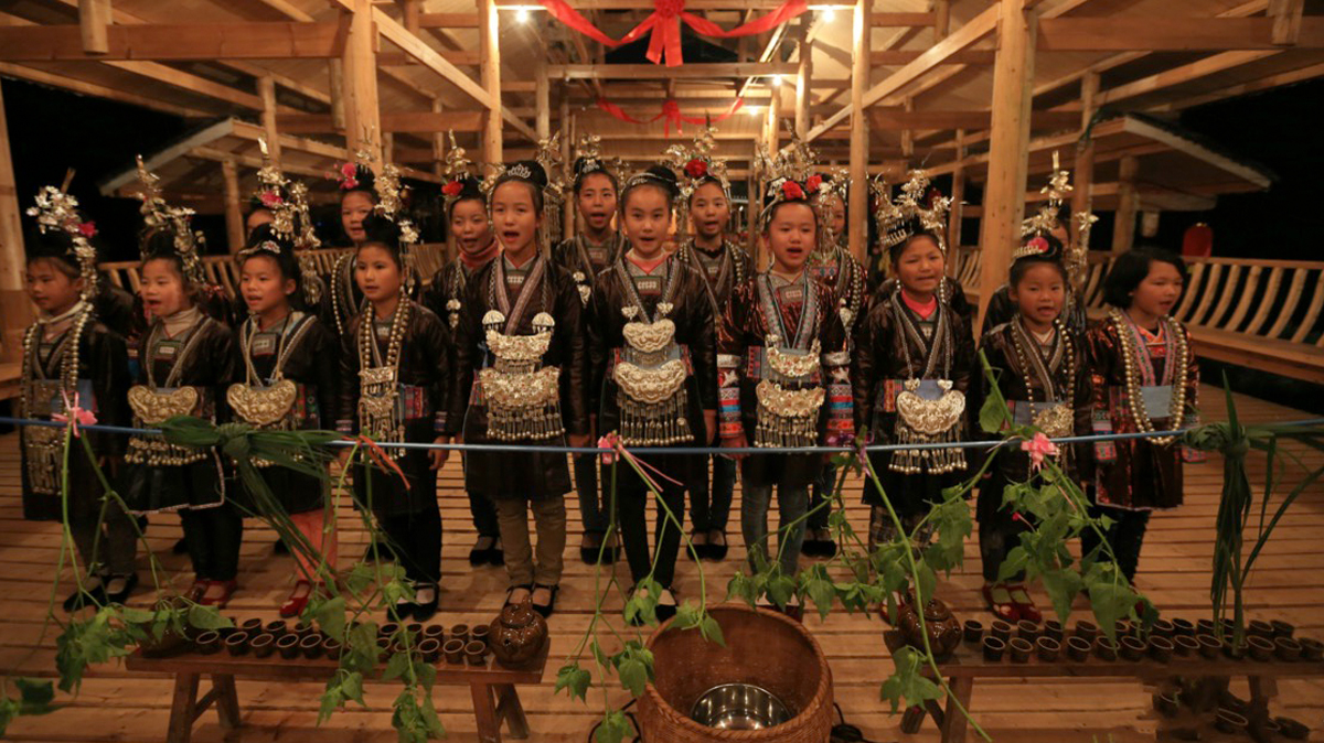 Children perform at the new Village Centre in Tongguan village, Guizhou province. Photo Fang Xu.